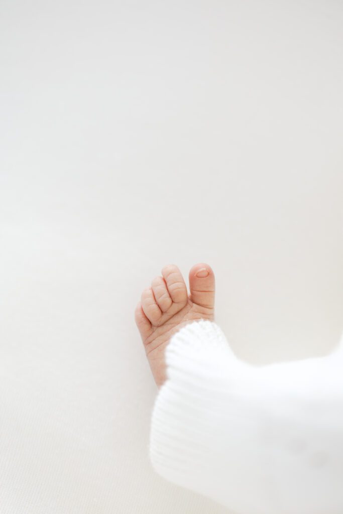 a baby's foot is photographed during her Newborn Photography in Edina, MN with Morgan Walworth Photography.