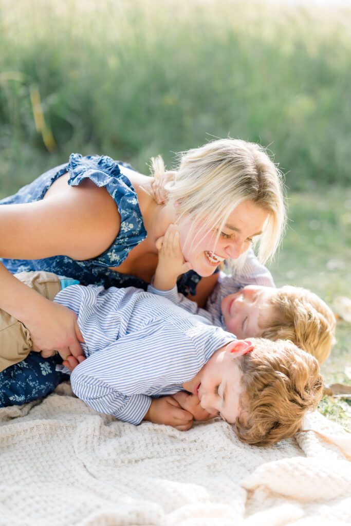 a mother hugs her children with Lakeville Family Photographer, Morgan Walworth Photography.